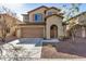 Inviting two-story home with a two-car garage and desert landscaping at 6713 E Elmwood St, Mesa, AZ 85205