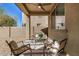 Charming covered patio with outdoor seating for enjoying the pleasant backyard view at 6713 E Elmwood St, Mesa, AZ 85205