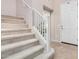 Carpeted staircase with white railing leading to the upper level of the home at 6713 E Elmwood St, Mesa, AZ 85205