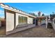 Charming backyard featuring low-maintenance gravel, a covered patio and views of the sky at 7038 N 28Th Ave, Phoenix, AZ 85051