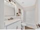 Well-lit bathroom with modern vanity, framed mirror, and shower and tub combo at 7038 N 28Th Ave, Phoenix, AZ 85051