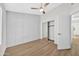 Bedroom with paneled wall and closet with sliding mirrored doors at 7038 N 28Th Ave, Phoenix, AZ 85051