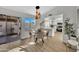 Bright dining area with modern pendant lighting and an open view of the well-equipped kitchen at 7038 N 28Th Ave, Phoenix, AZ 85051