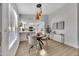 Cozy dining area featuring pendant lights and an open view of the stylish, well-equipped kitchen at 7038 N 28Th Ave, Phoenix, AZ 85051