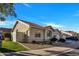 Attractive single-story house showcasing a well-kept lawn, tiled roof, and an attached two-car garage at 7038 N 28Th Ave, Phoenix, AZ 85051