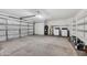 Spacious garage with ample shelving, laundry area, and a well-lit interior at 7038 N 28Th Ave, Phoenix, AZ 85051