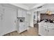 Bright kitchen featuring white cabinetry, stainless steel appliances, and quartz countertops at 7038 N 28Th Ave, Phoenix, AZ 85051