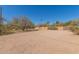 Large gravel front yard area, partially enclosed with a block fence, offering ample space at 7102 E Larkspur Dr, Scottsdale, AZ 85254