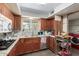 Traditional eat-in kitchen featuring a stainless steel dishwasher and a garden view window over the sink at 7102 E Larkspur Dr, Scottsdale, AZ 85254