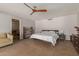 Spacious main bedroom with a modern ceiling fan and view into an adjoining room at 7102 E Larkspur Dr, Scottsdale, AZ 85254