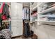 Well-organized walk-in closet featuring built-in shelving and plenty of storage space at 7102 E Larkspur Dr, Scottsdale, AZ 85254