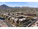 A full-service, modern building that harmonizes with nature, showcasing rooftop trees and lush palm trees surrounding it at 7157 E Rancho Vista Dr # 2012, Scottsdale, AZ 85251