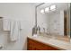 Modern bathroom featuring a large mirror and vanity with wood cabinets at 7157 E Rancho Vista Dr # 2012, Scottsdale, AZ 85251