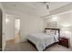 Cozy bedroom with a ceiling fan, carpeted floor, and view to the bathroom at 7157 E Rancho Vista Dr # 2012, Scottsdale, AZ 85251