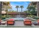 Inviting courtyard featuring a tranquil water feature, palm trees, and comfortable seating for relaxation at 7157 E Rancho Vista Dr # 2012, Scottsdale, AZ 85251