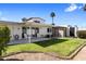 Spacious backyard featuring green grass, a shed, and patio furniture at 7644 E Mariposa Dr, Scottsdale, AZ 85251