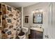 Bathroom with a patterned shower curtain and bear-themed accessories at 7644 E Mariposa Dr, Scottsdale, AZ 85251