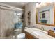 Bathroom featuring a glass shower and a granite countertop at 7644 E Mariposa Dr, Scottsdale, AZ 85251