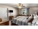 Comfortable bedroom featuring neutral walls, carpet, and a window with natural light at 7644 E Mariposa Dr, Scottsdale, AZ 85251