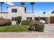 Charming home featuring desert landscaping, a covered parking space, and a Spanish style roof at 7644 E Mariposa Dr, Scottsdale, AZ 85251