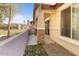 Outdoor patio featuring a stone column detail leading to sliding glass doors at 7726 E Baseline Rd # 110, Mesa, AZ 85209