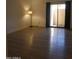 Bedroom with wood-look floors, ample natural light, and curtains providing privacy at 7950 E Starlight Way # 128, Scottsdale, AZ 85250