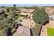 Large backyard featuring a covered patio, basketball court, swimming pool, and beautiful mature trees at 8421 W Alex Ave, Peoria, AZ 85382