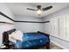 Inviting bedroom featuring window with shutters, ceiling fan, and neutral paint at 8421 W Alex Ave, Peoria, AZ 85382