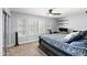 Comfortable bedroom featuring ceiling fan, shutters, and natural light at 8421 W Alex Ave, Peoria, AZ 85382