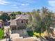 Aerial view of home featuring a three car garage and well-kept landscaping at 8421 W Alex Ave, Peoria, AZ 85382