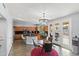 Bright kitchen and breakfast nook area with wood floors, granite countertops, and stainless appliances at 8421 W Alex Ave, Peoria, AZ 85382