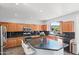 Well-equipped kitchen featuring granite countertops, stainless steel appliances, and a central island at 8421 W Alex Ave, Peoria, AZ 85382