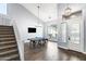 Entryway/living room showcasing stairs, a ping pong table, modern lighting, and wood floors at 8421 W Alex Ave, Peoria, AZ 85382