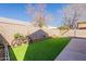 Backyard with green grass and brick planter at 8772 W Grovers W Ave, Peoria, AZ 85382