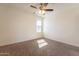 Neutral bedroom featuring ceiling fan, window and neutral carpet at 8772 W Grovers W Ave, Peoria, AZ 85382