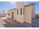 An exterior view of the home featuring desert landscaping and an inviting front entrance at 8772 W Grovers W Ave, Peoria, AZ 85382