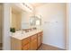 Bright bathroom featuring double sinks, stylish mirrors, and a modern light fixture at 9705 E Butte St, Mesa, AZ 85207