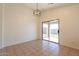 Cozy dining area with tile flooring and sliding glass door leading to the backyard at 9705 E Butte St, Mesa, AZ 85207