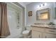 Well-lit bathroom features a shower-tub combo and granite vanity at 9806 W Long Hills Dr, Sun City, AZ 85351