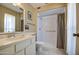 Cozy bathroom with a tiled shower, toilet, and vanity with ample storage space at 9806 W Long Hills Dr, Sun City, AZ 85351