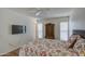 Cozy bedroom featuring a queen-sized bed, a flat-screen TV, and ample natural light from two windows at 9806 W Long Hills Dr, Sun City, AZ 85351