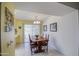 Open-concept dining area with tiled flooring and large windows at 9806 W Long Hills Dr, Sun City, AZ 85351