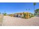 Charming single-story home features desert landscaping in front yard at 9806 W Long Hills Dr, Sun City, AZ 85351