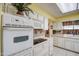 Bright kitchen with white oven and microwave oven combination at 9806 W Long Hills Dr, Sun City, AZ 85351