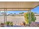 View from the charming covered patio with desert landscaping details at 9806 W Long Hills Dr, Sun City, AZ 85351