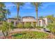 Stunning exterior of a home with unique circular architectural elements and an eye-catching display of colorful flowers at 11000 N 77Th Pl # 1072, Scottsdale, AZ 85260