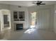 Bright living room featuring a fireplace, neutral carpeting, and sliding glass doors leading to outdoor space at 11000 N 77Th Pl # 1072, Scottsdale, AZ 85260