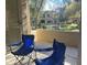 Charming patio view with comfortable seating, overlooking lush landscaping and a serene water fountain at 11000 N 77Th Pl # 1072, Scottsdale, AZ 85260