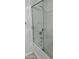 Shower with a glass door and chrome fixtures at 11000 N 77Th Pl # 1072, Scottsdale, AZ 85260