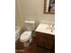 Full bathroom with terra cotta tiled floor, toilet, vanity and shower/tub combo at 1111 E Village Circle N Dr, Phoenix, AZ 85022